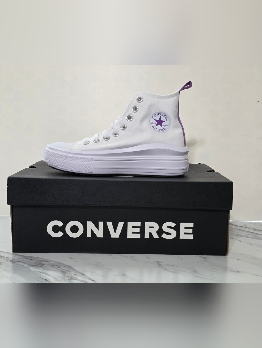 Converse White High Top Sneaker with Purple Star Accent